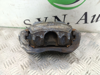 Суппорт передний правый TNJ31