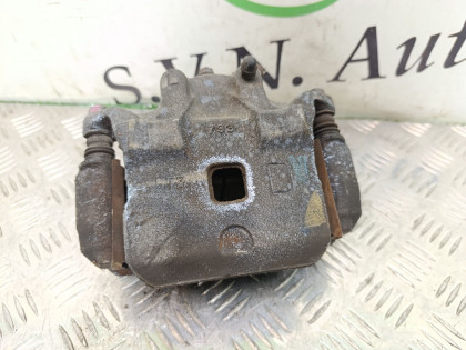 Суппорт передний левый TNJ31