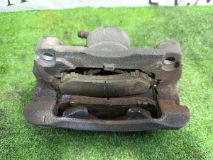Суппорт передний левый NISSAN X-TRAIL OEM 41011JE00A DNT31 2010